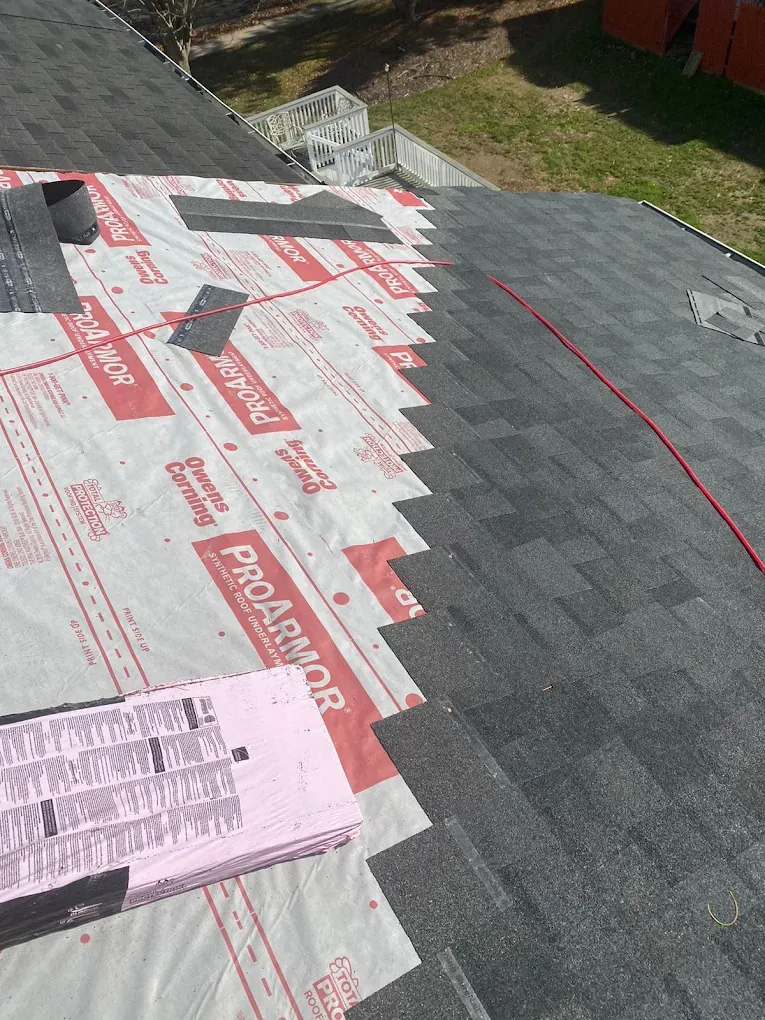 New dark shingles being laid over Owens Corning ProArmor underlayment